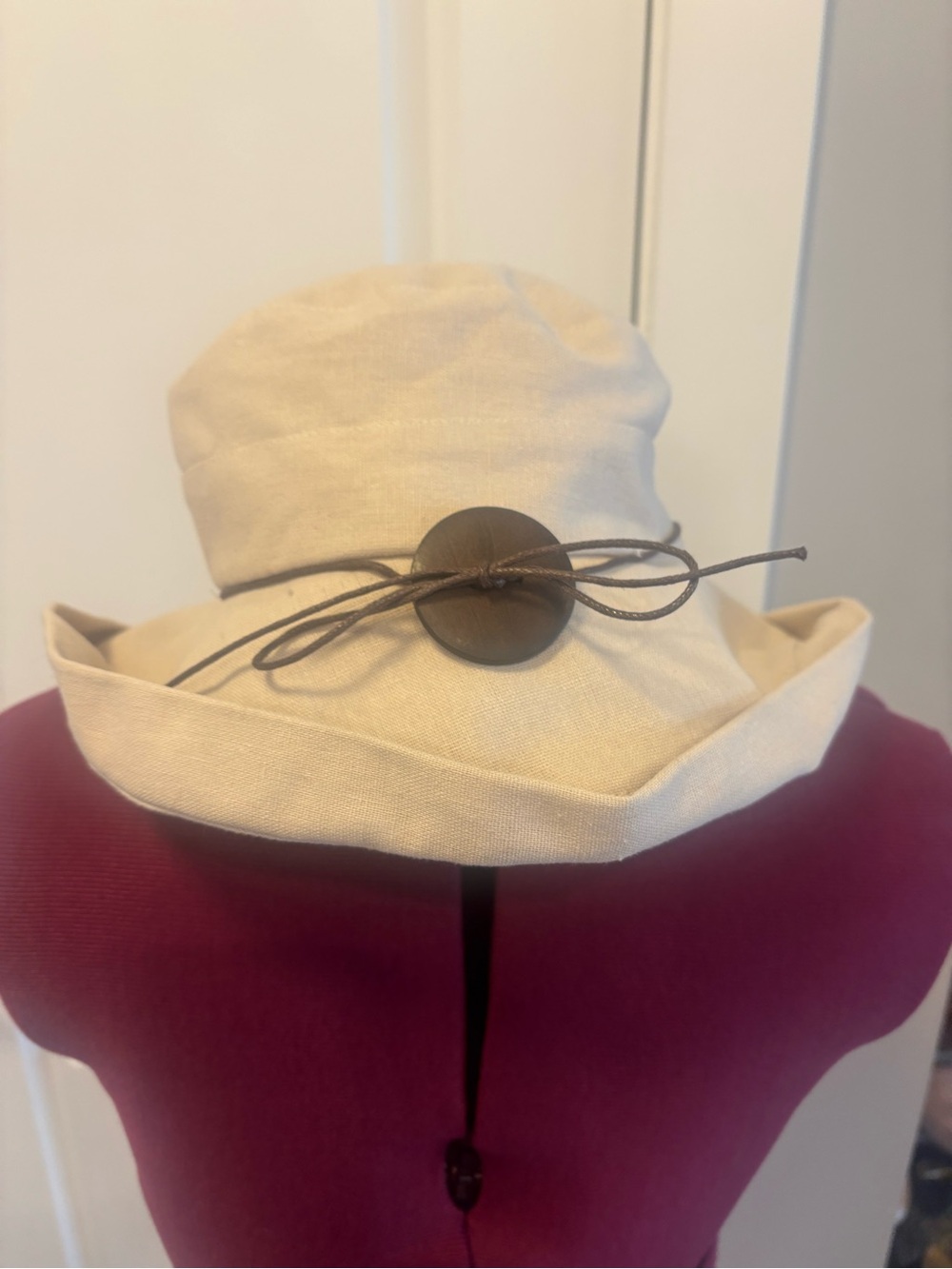 Classic Cream Sun Hat with Brown Button Detail. Cotton/linen